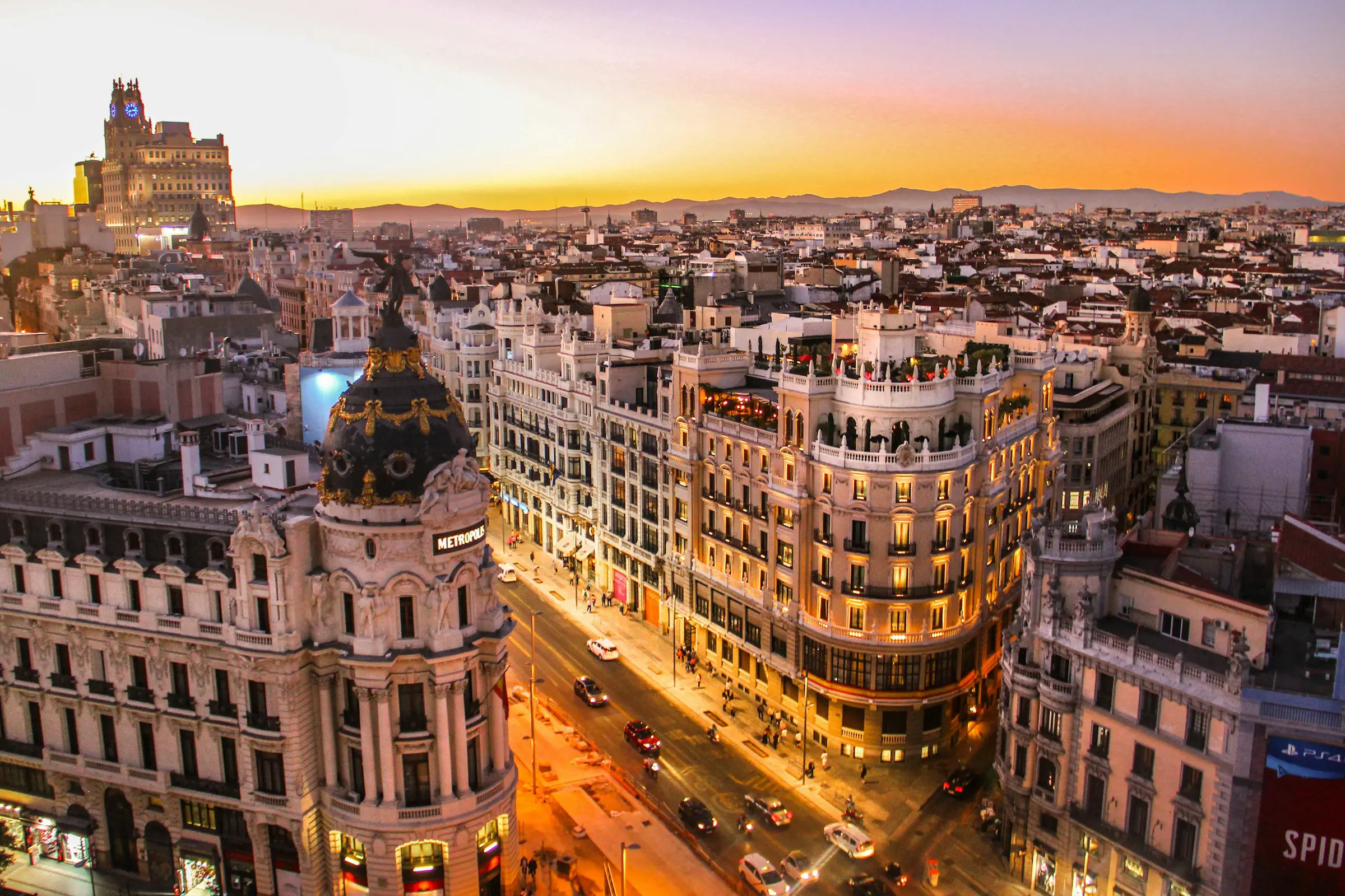 Sunset over Barcelona with buildings and evening lights