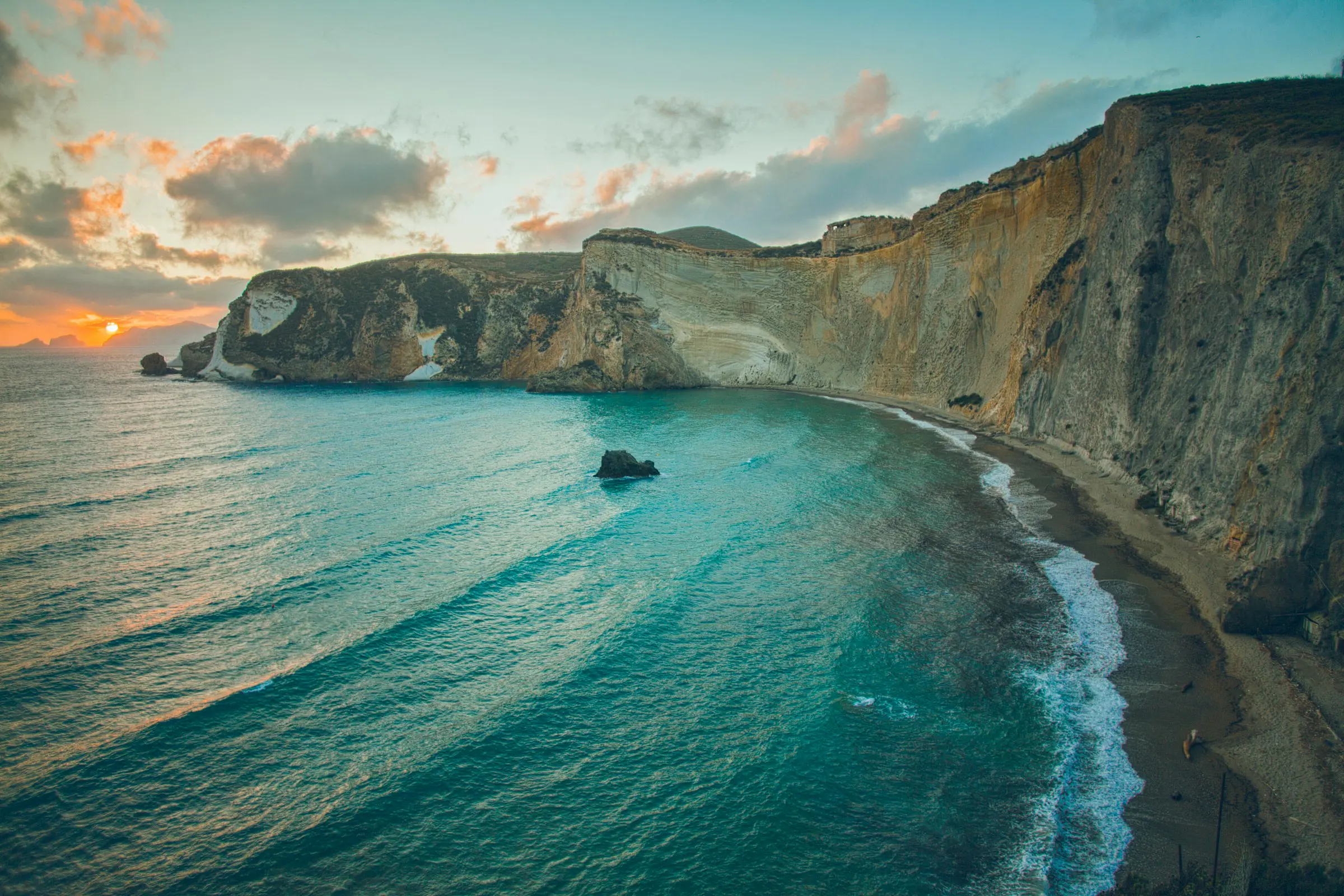 sunset at coastal cliffs meeting the sea in Italy