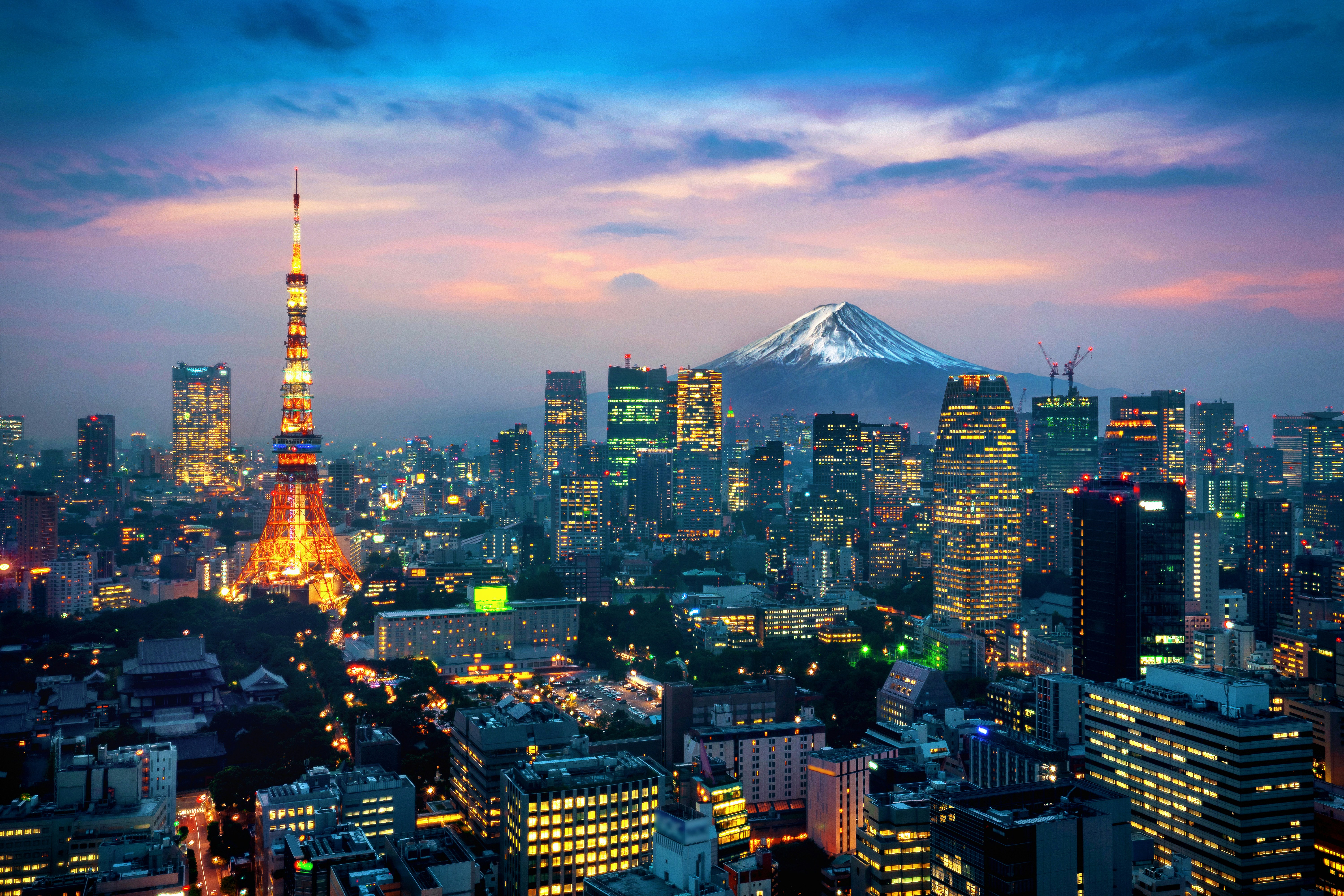 Travel to Tokyo - View of Tokyo buildings, Tokyo Tower and Mount Fuji in the background during a sunrise