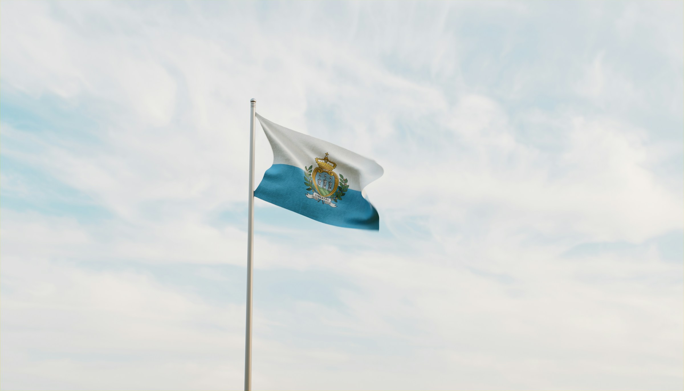 San Marino's flag flies against a blue sky.